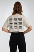Vintage weißes Oversized Damen T-Shirt mit grafischem Backprint von La Label Beige